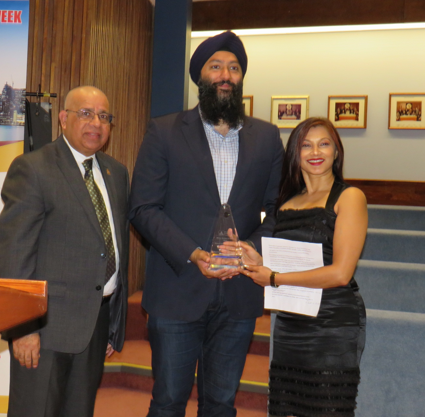 Sonia Semy receiving award