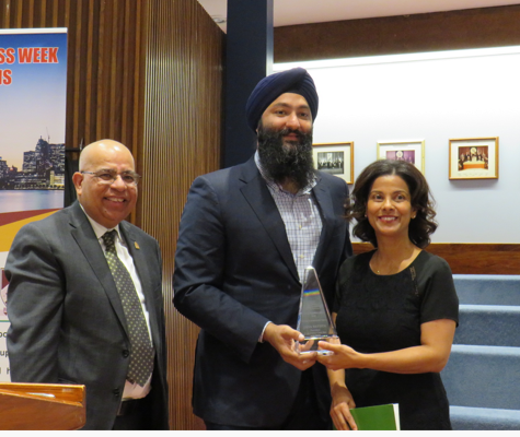 Gina Batista receiving award