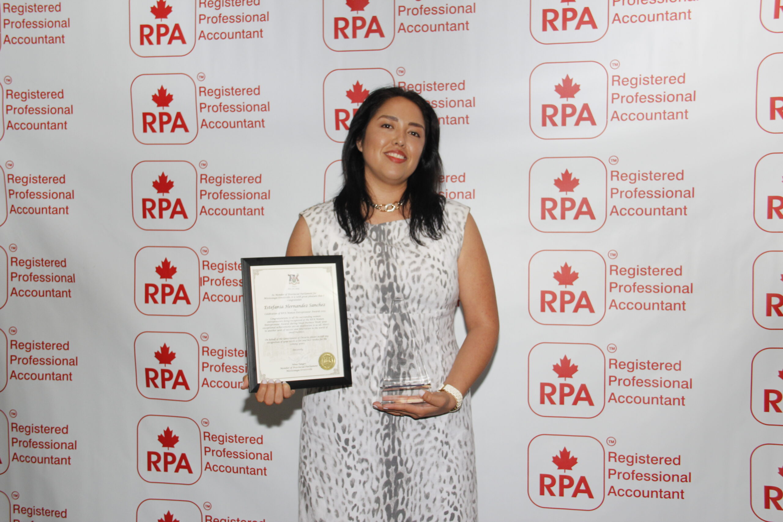 Estefania Hernandez receiving award