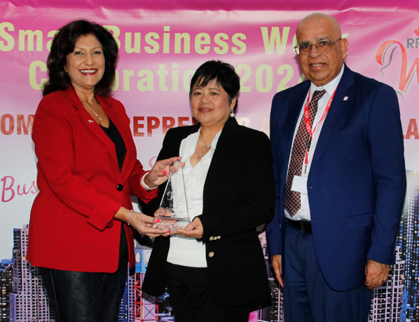 Corie Laraya-Coutts receiving award